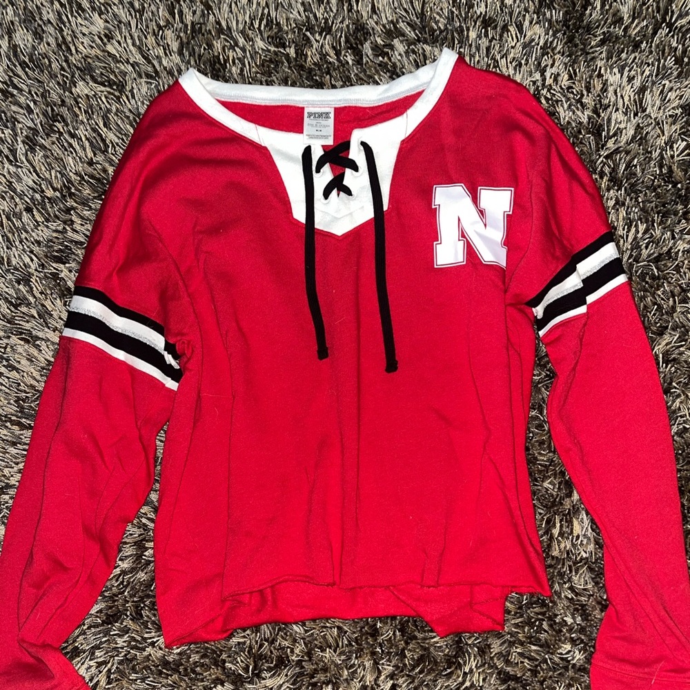 Size medium. Pink Victoria Secret. Long sleeve red Nebraska shirt.